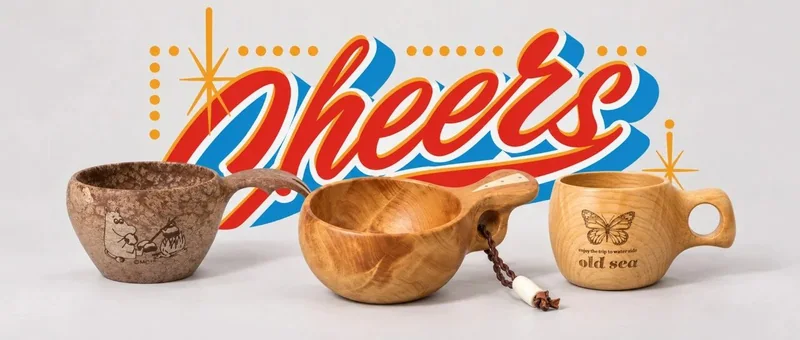 三隻不同造型的木杯置於彩色CHEERS手寫字前